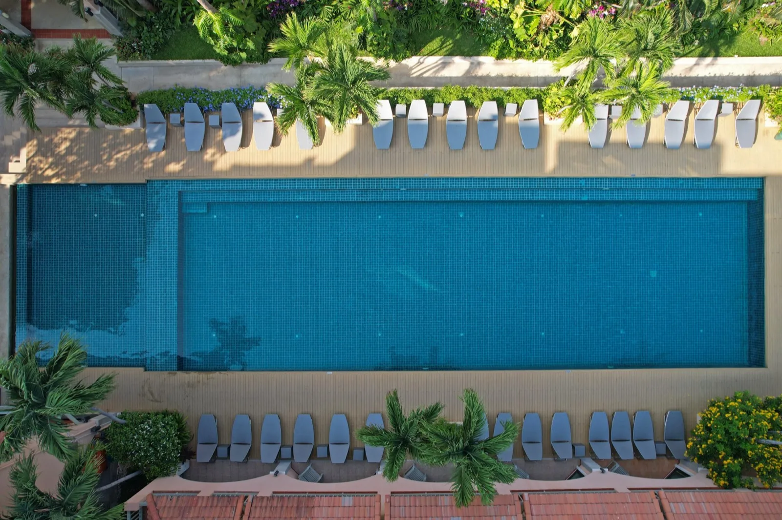 Aerial view of the infinity pool and sunbeds at Anantasila Beach Resort Hua Hin