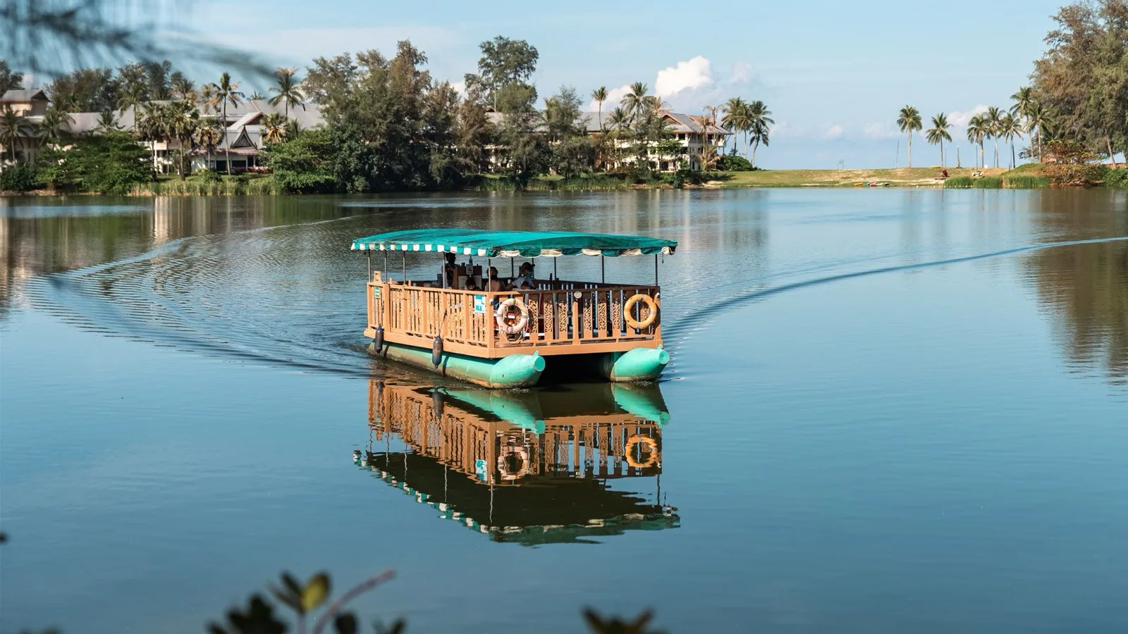 Cassia jetty boat crossing the lagoon from Cassia Phuket towards Bang Tao Beach