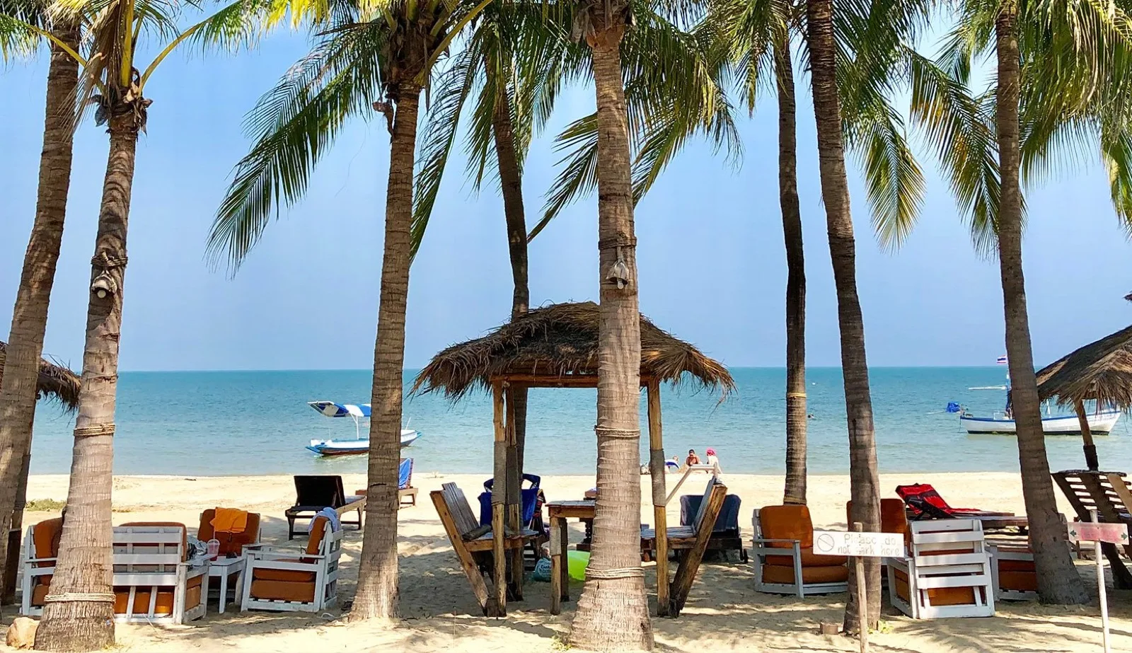 Beachfront loungers and palms on the bay at Dolphin Bay Resort, Sam Roi Yot