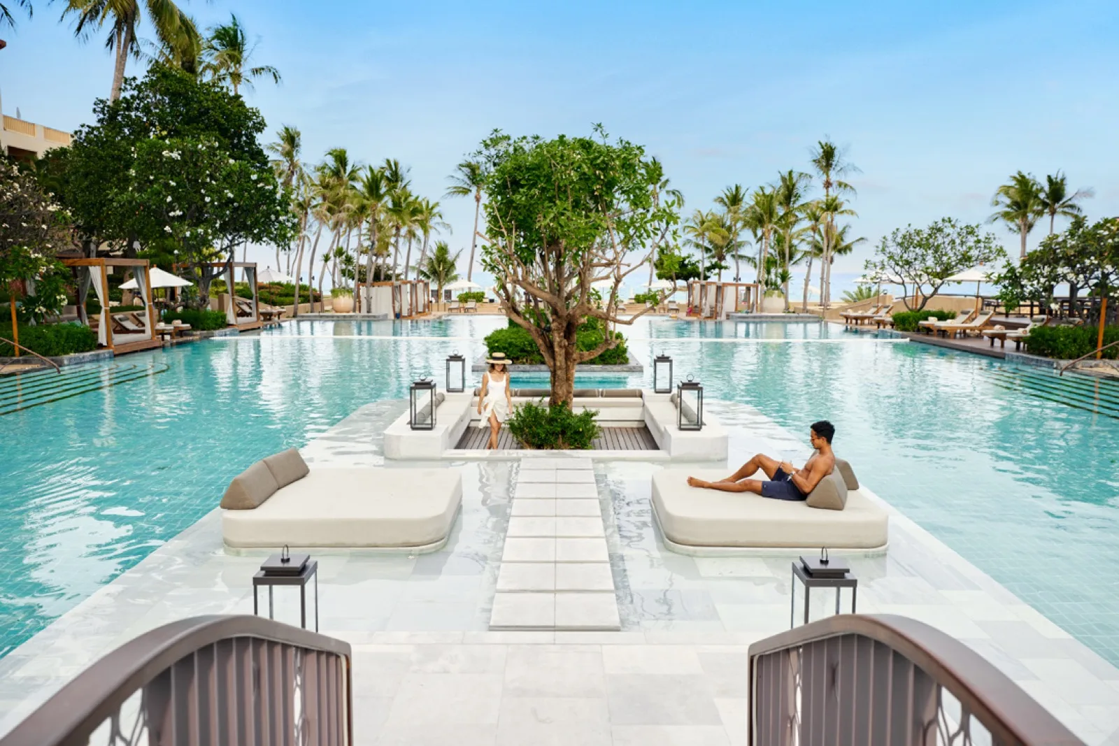 Main swimming pool with central daybed island at Dusit Thani Hua Hin in Cha-am