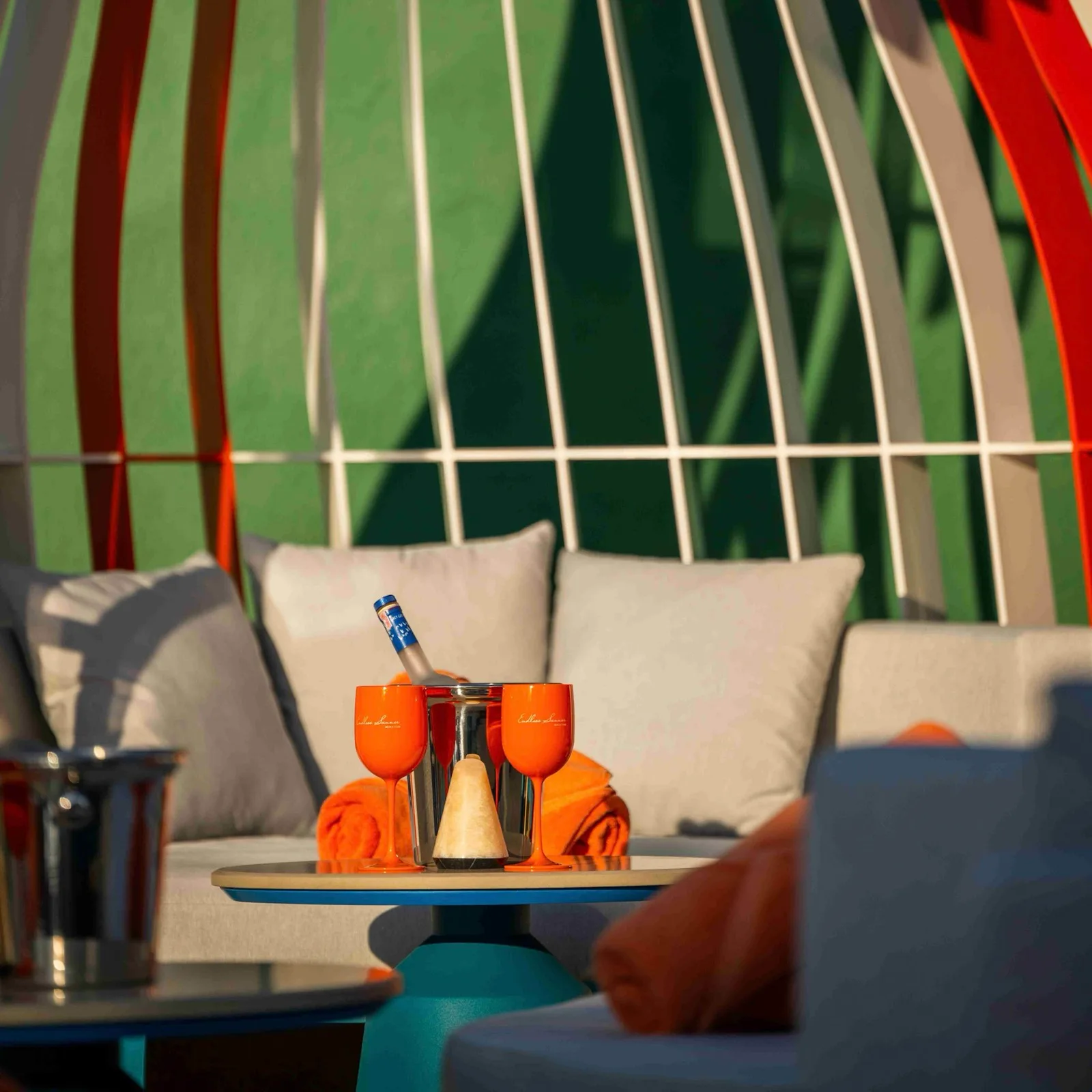 Cabana with cushioned sofa and drinks setup at Endless Summer Beach Club, Courtyard by Marriott Patong