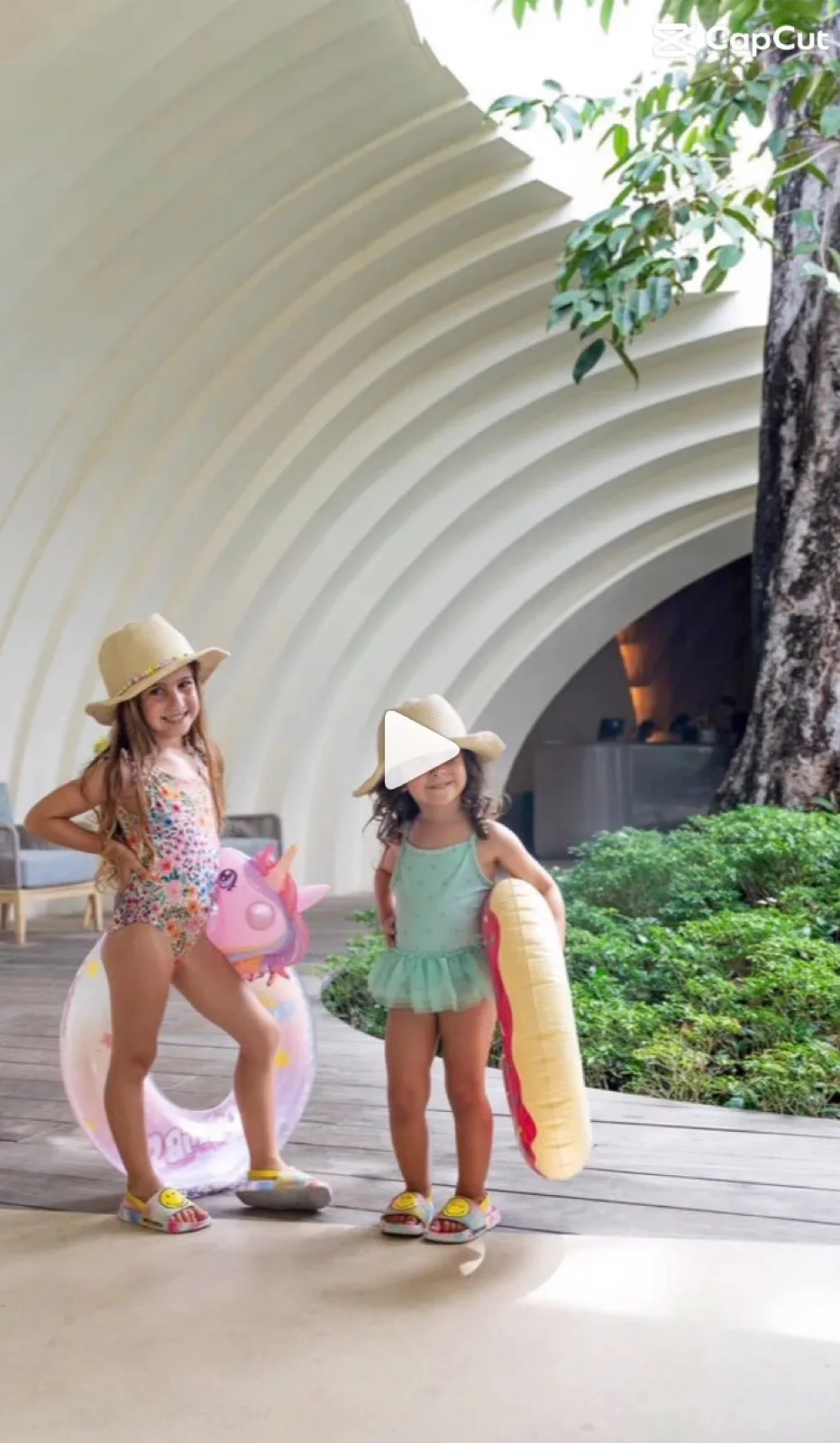 Two children with swim rings in the sculpted entrance area at Holiday Inn Resort Samui Bophut Beach