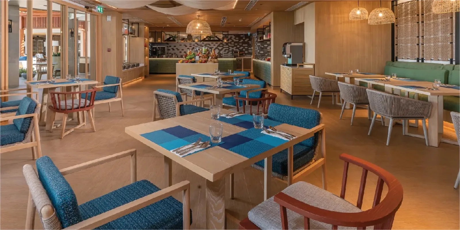 Restaurant dining room with blue chairs at Holiday Inn Resort Samui Bophut Beach