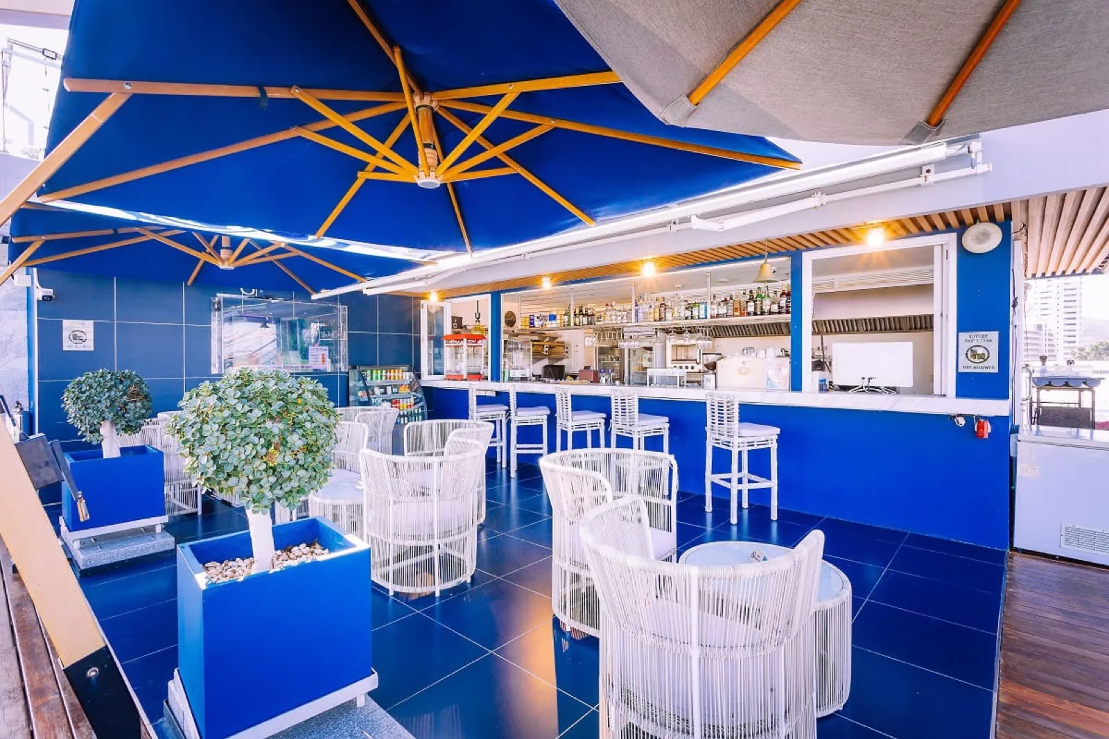 BLU BAR rooftop bar at Hotel Clover Patong with blue and white seating