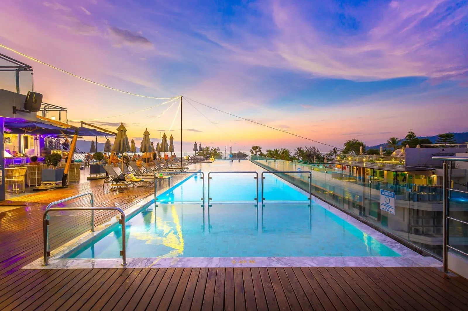 Hotel Clover Patong rooftop pool at sunset with sea views over Patong
