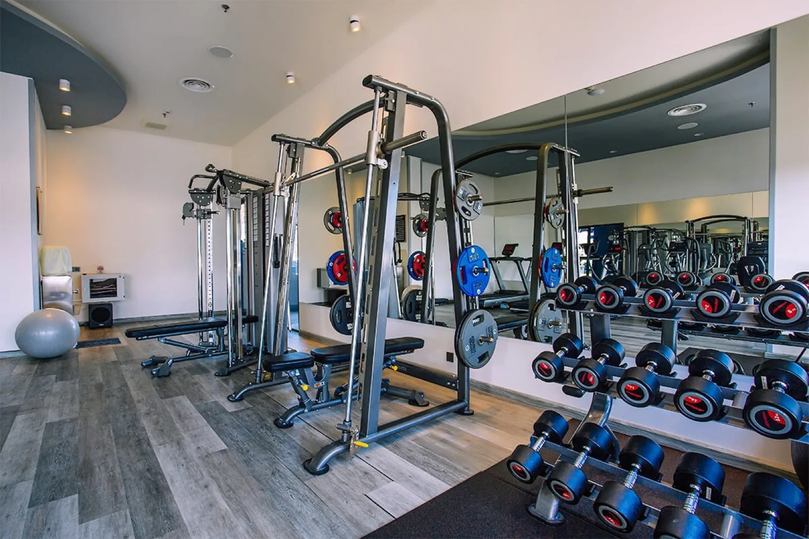 Fitness centre at Hotel Clover Patong Phuket with weights and cable machines