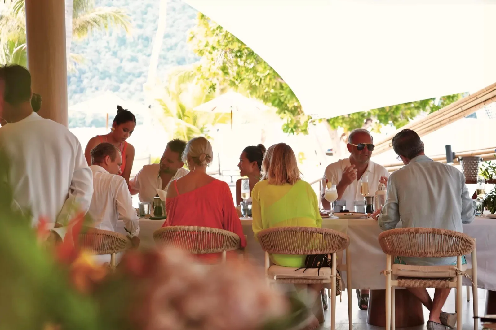 Guests dining on the shaded deck at Irene Resort Koh Lipe during a SOL Pass day