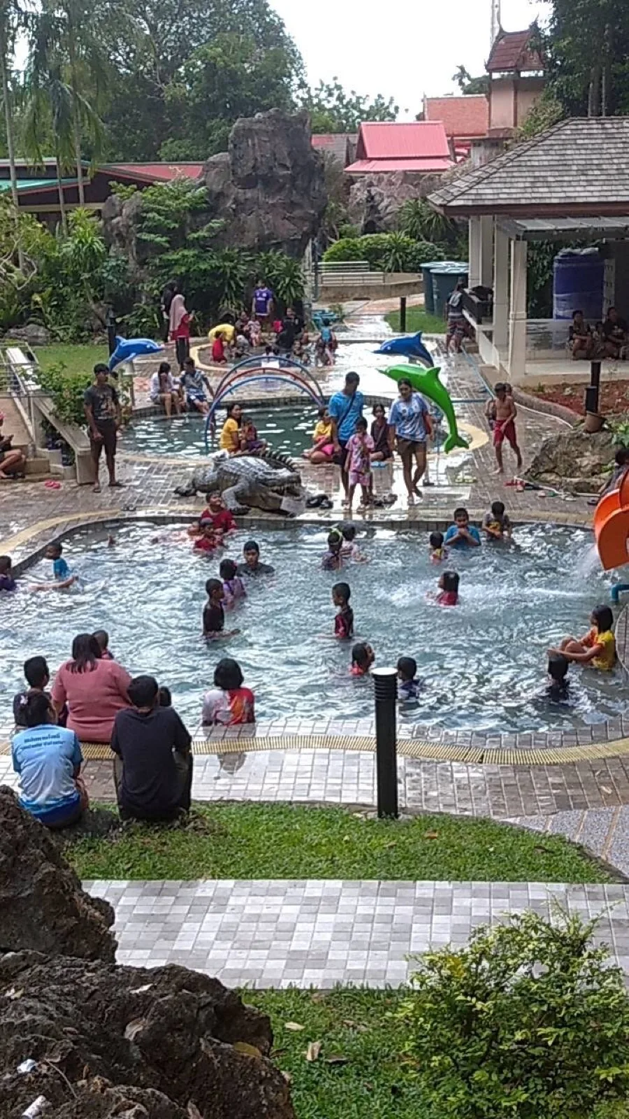 Family pool at Khao Chaison Hot Spring on a busy day