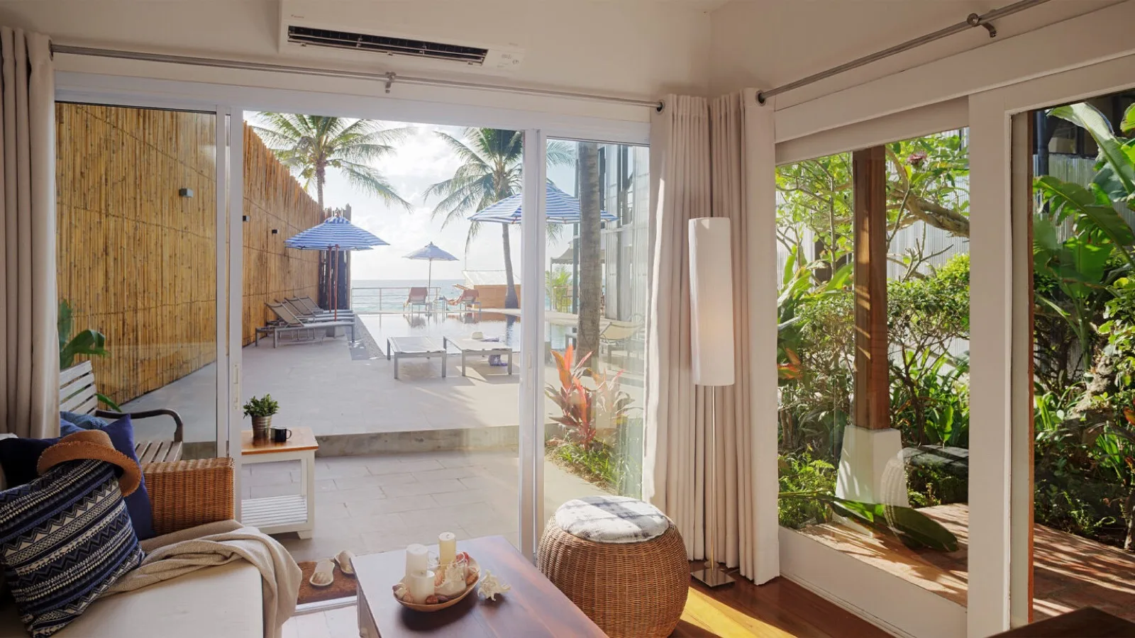 Pool view suite opening onto a terrace at Malibu Beach Resort Samui