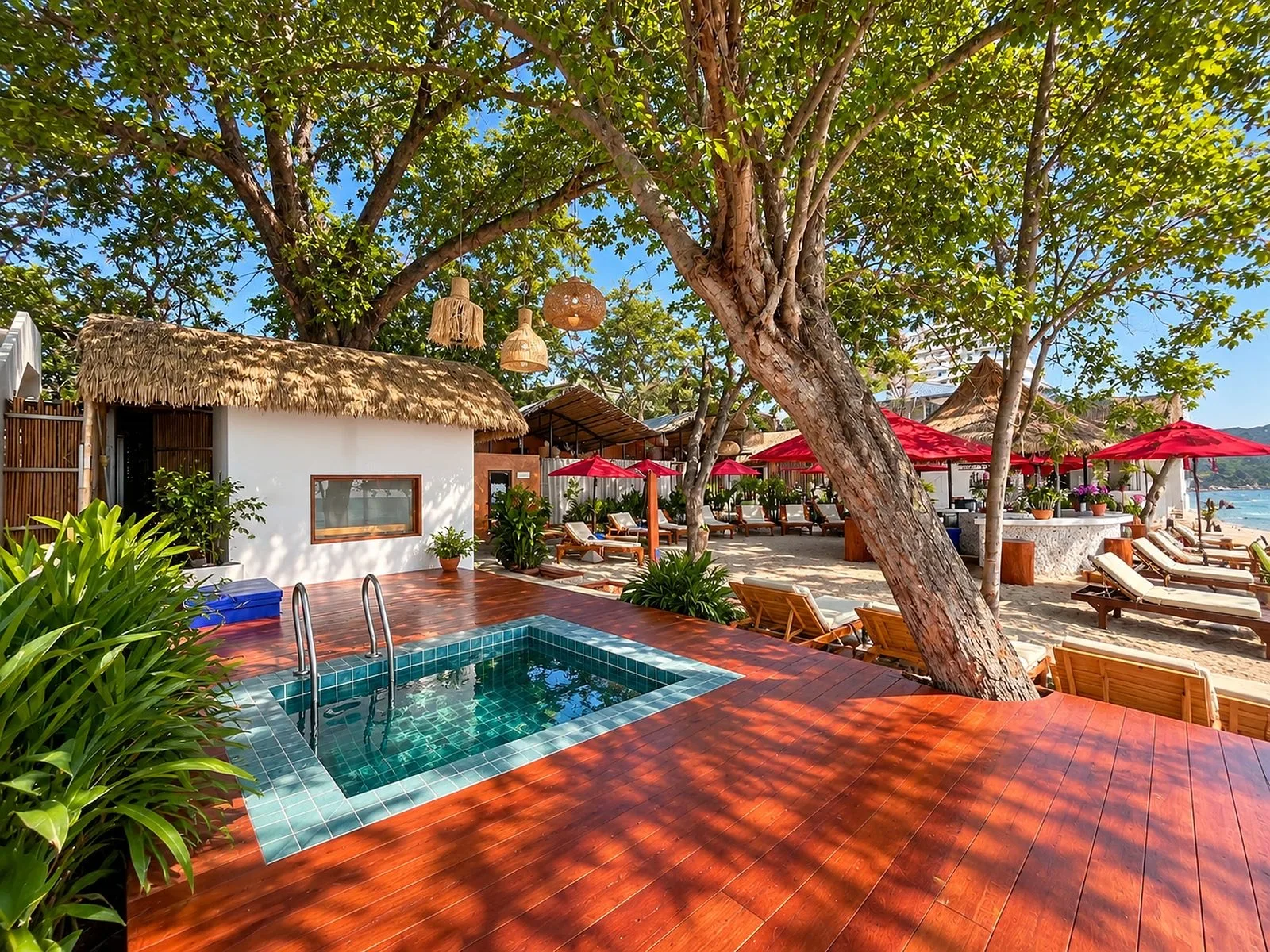 Plunge pool, sauna hut and sun loungers under shade trees at Mama Daeng Beach Sauna