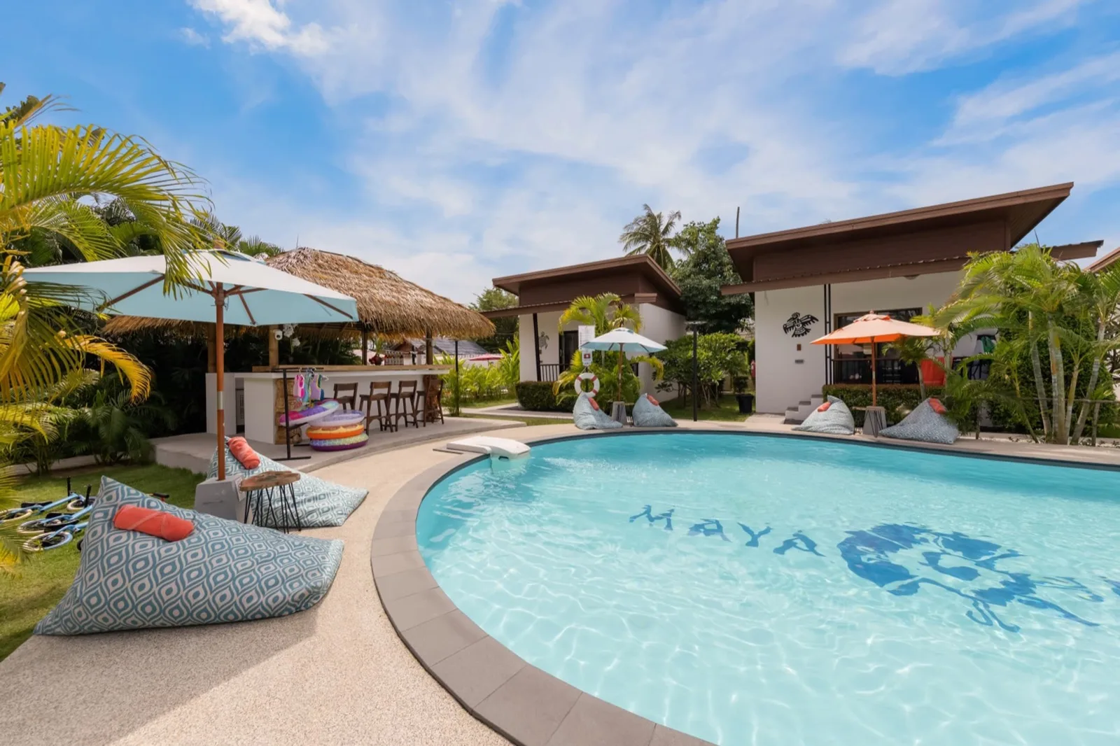 Maya logo pool with beanbags and umbrellas at Maya Resort Samui