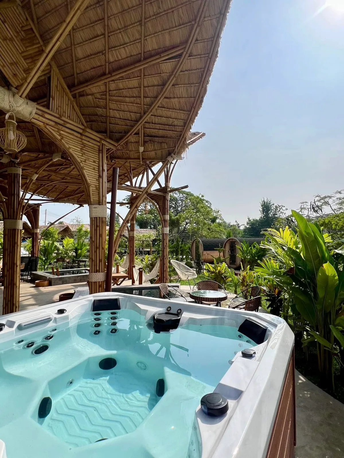 Outdoor jacuzzi beside a bamboo pavilion at Mojo Spa and Retreat