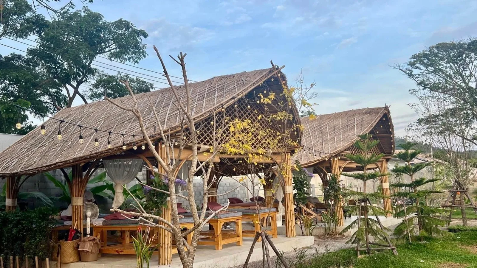 Thatched relaxation salas in the garden at Mojo Spa and Retreat Hua Hin