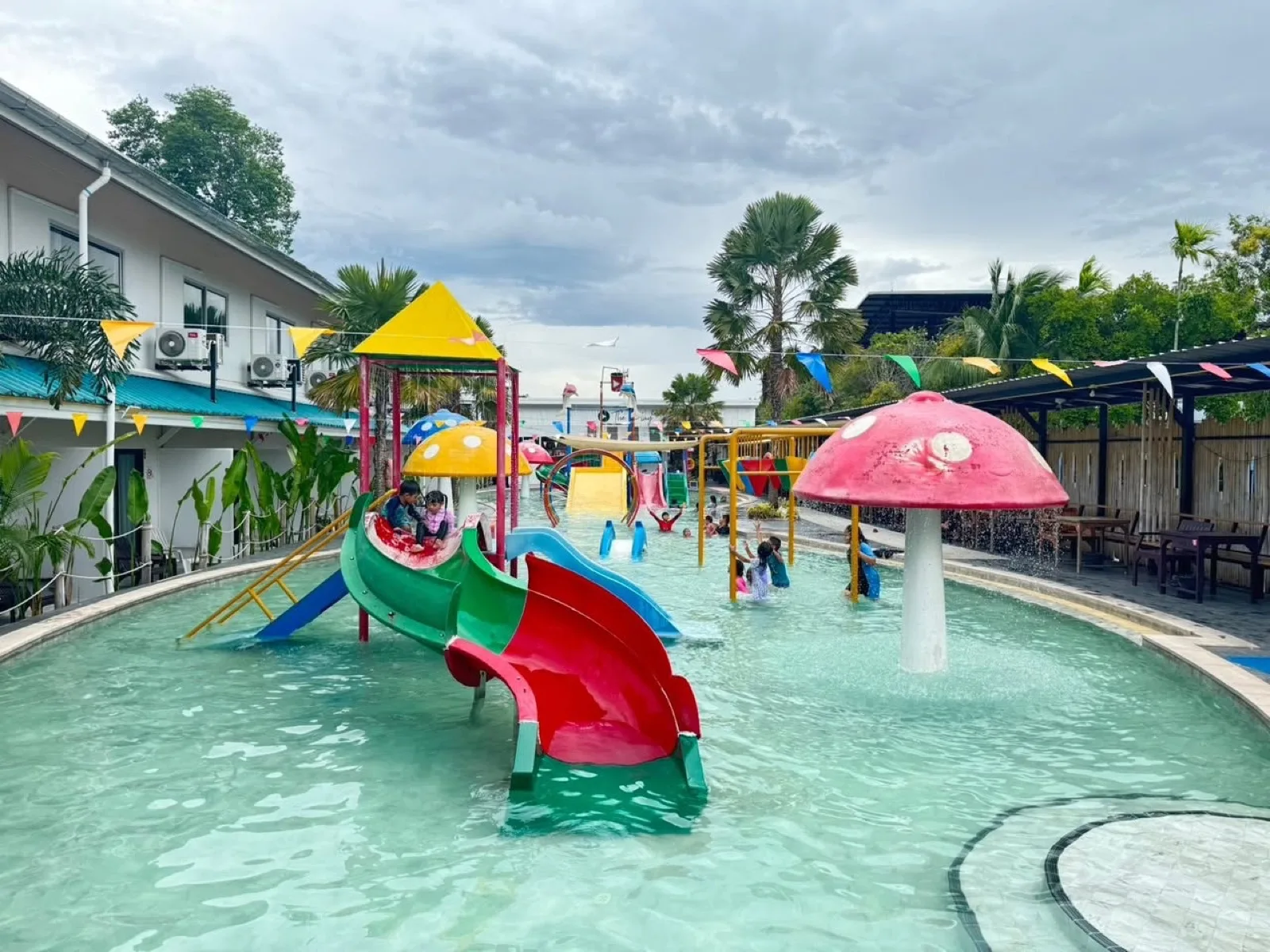Red and green slides in the 60 cm pool at The Play Waterpark