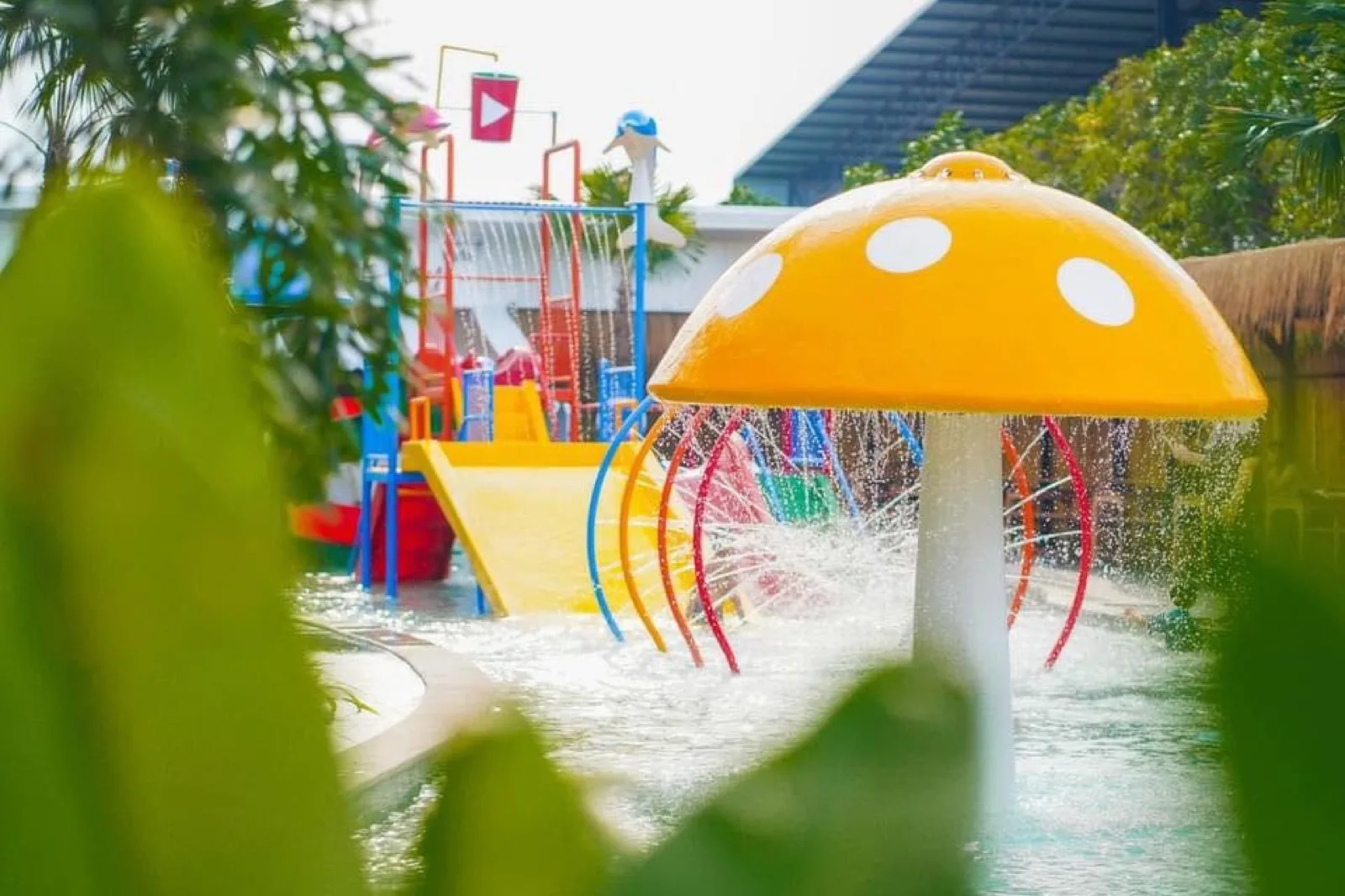 Yellow mushroom fountain and slides at The Play Waterpark, Nakhon Non Len Hotel