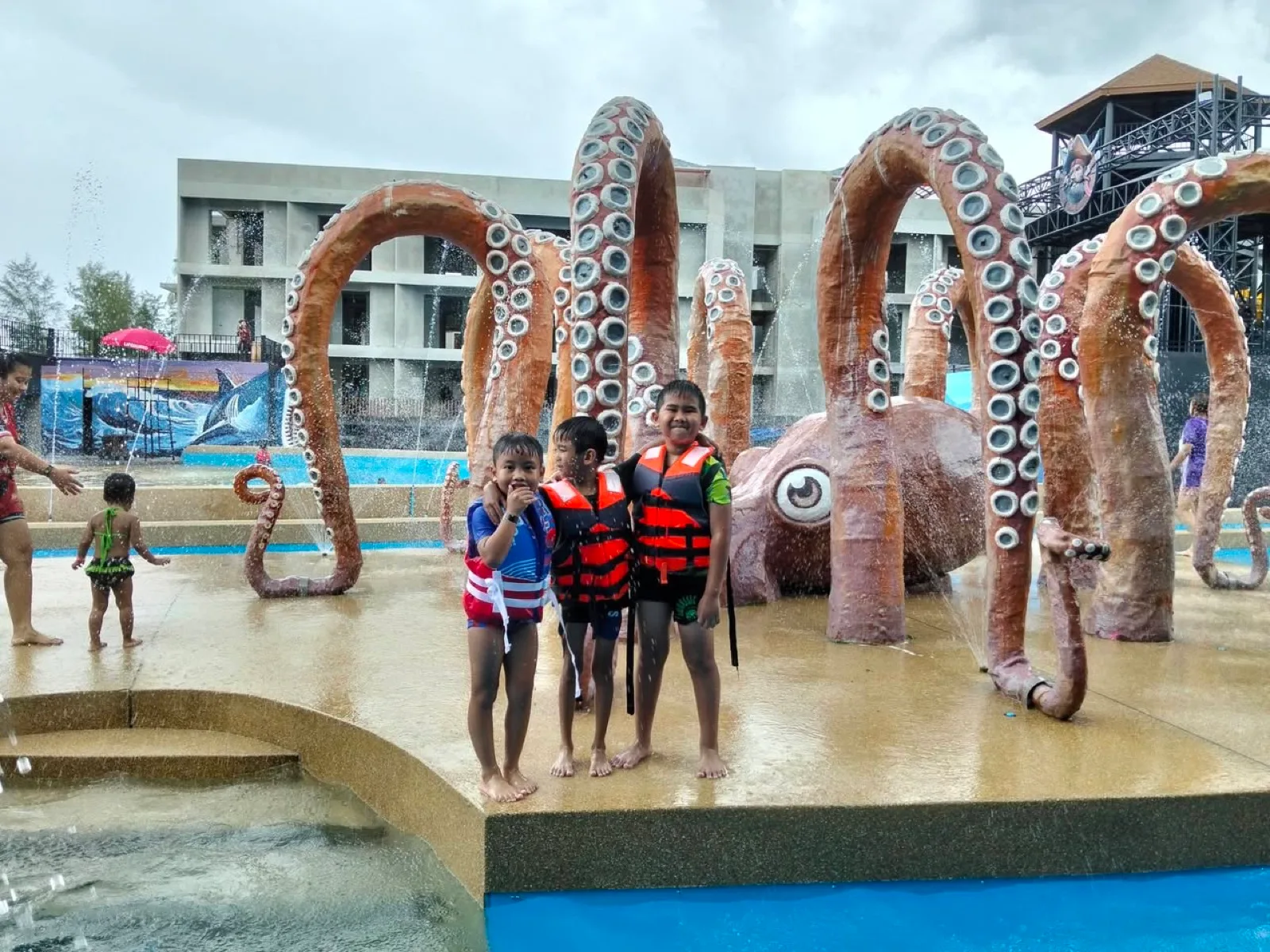 Giant octopus tentacle fountains in the splash pool at Natural Beach Water Park, Tha Sala
