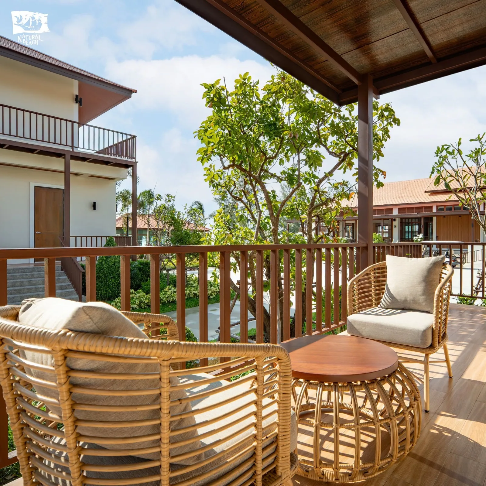 Rattan seating on a villa balcony at Natural Beach Resort, Tha Sala