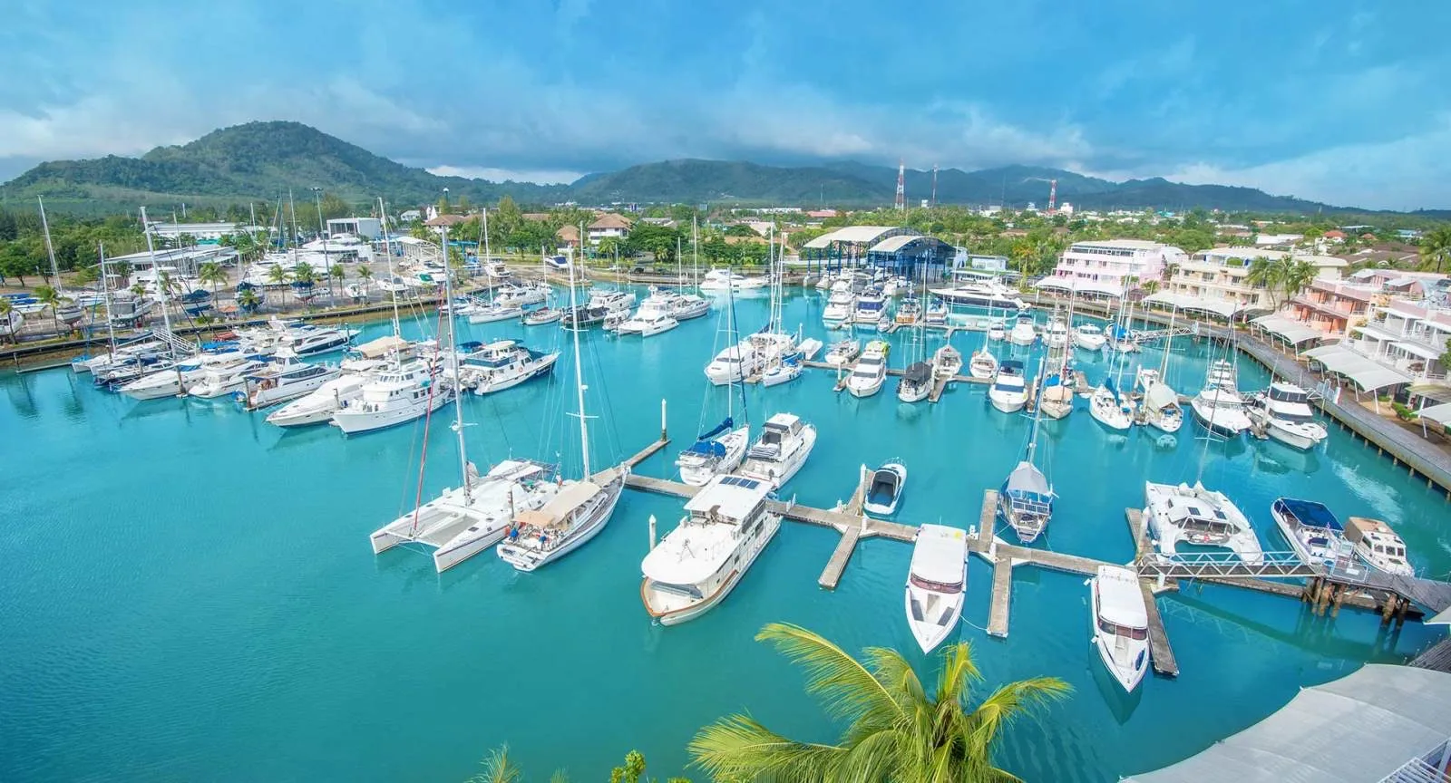 Yachts moored at Phuket Boat Lagoon marina beside NH Boat Lagoon Phuket Resort