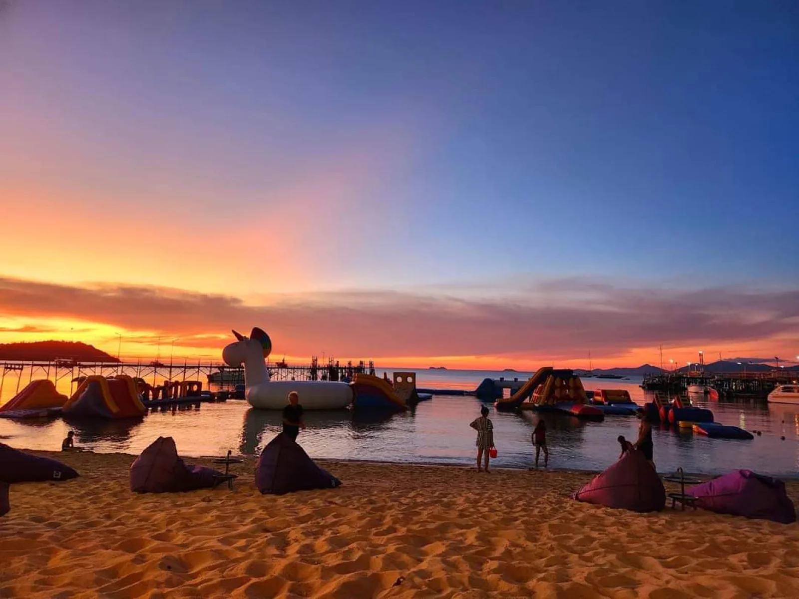 Sunset over Bangrak Beach and the inflatables at Samui Pier Resort