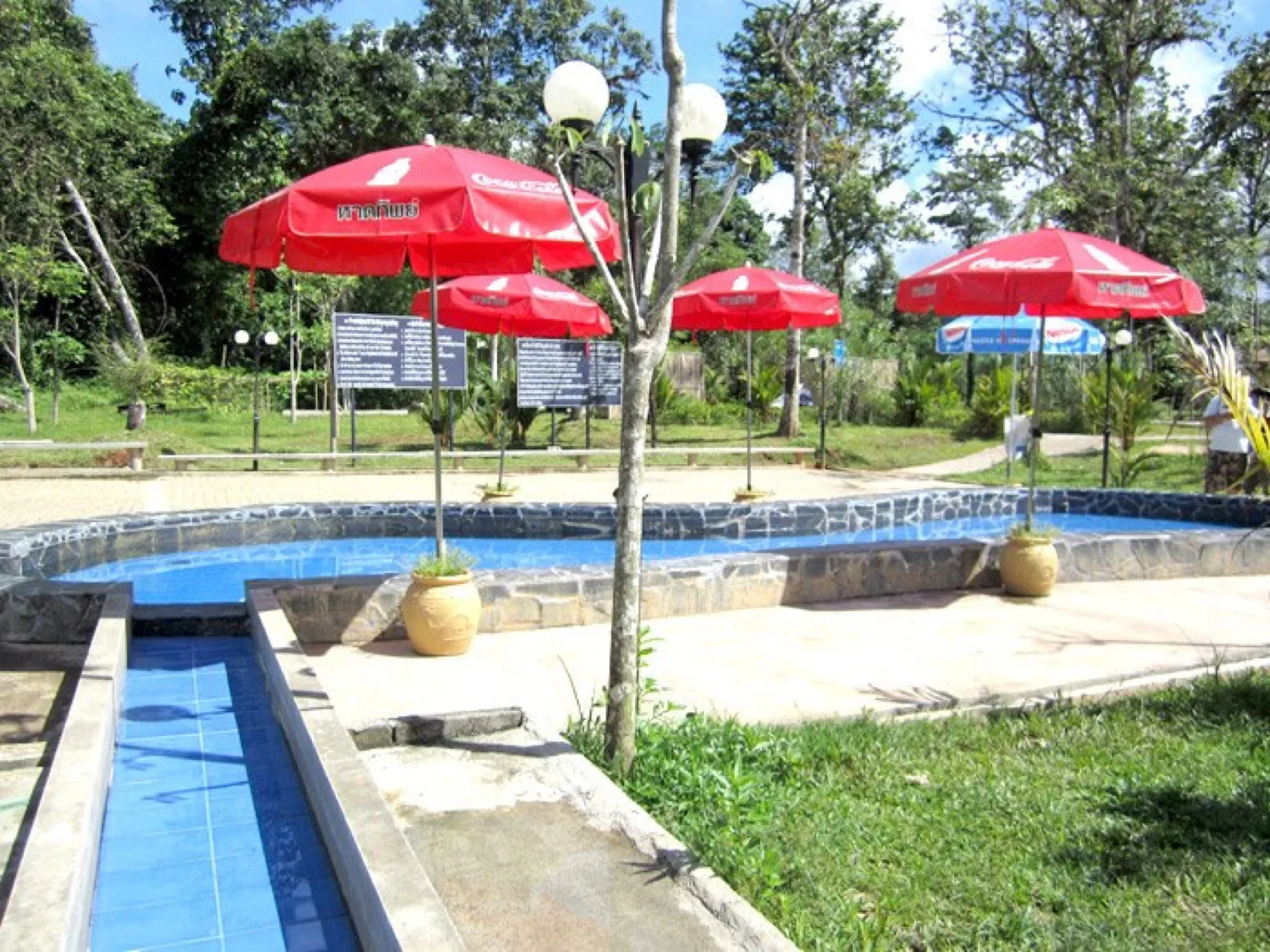 Long shallow channel pool and gardens at Rommanee Hot Spring in Phang Nga