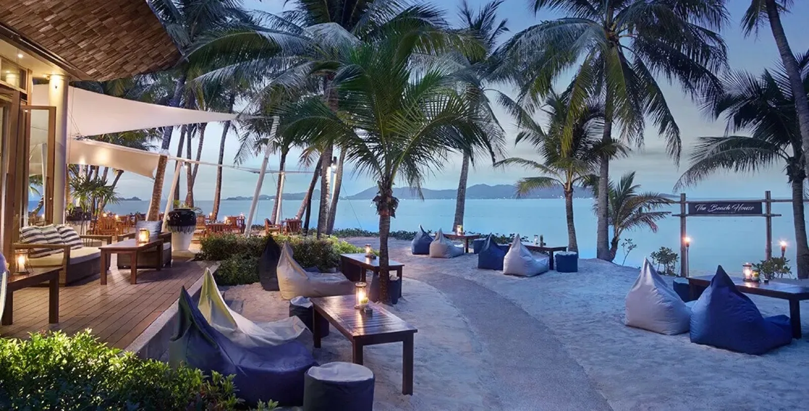 The Beach House terrace with beanbags facing Maenam Beach at Santiburi Koh Samui