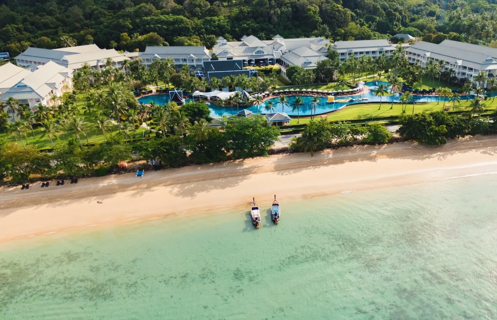 Aerial view of Sofitel Krabi Phokeethra on Klong Muang Beach with the lagoon pool behind the sand