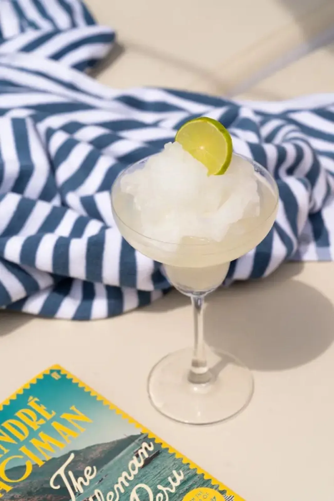 Frozen cocktail with a striped towel at SunRay Social & Swim Club Koh Samui