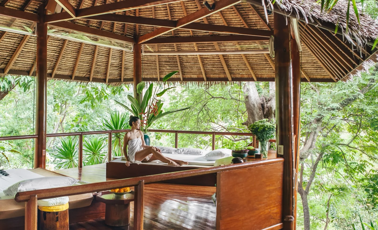 Open-air massage bay overlooking the forest at Tamarind Springs Lamai