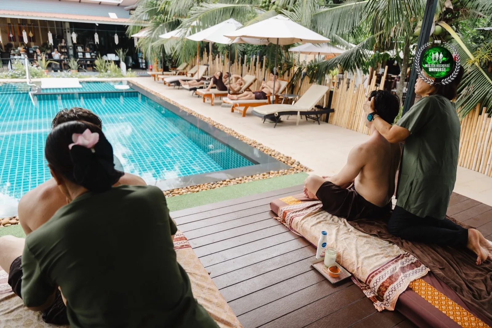 Guest receiving a massage beside the garden pool at The Cottage Retreat