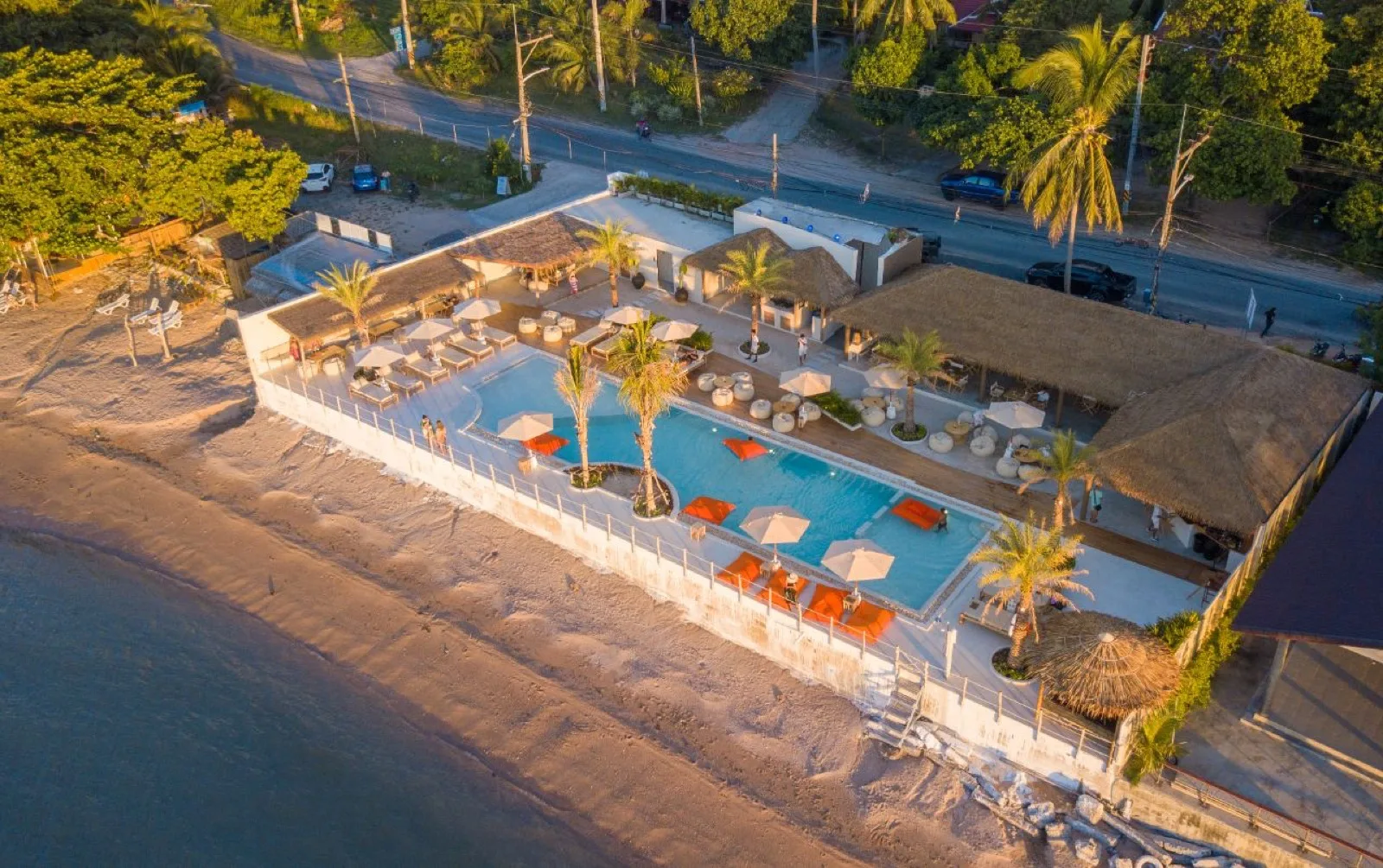 Drone view of The Deck Beach Club pool deck and sunbeds on Koh Samui's north coast