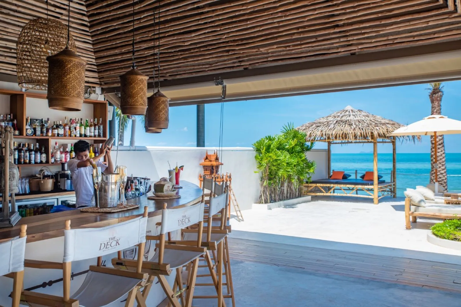 Bar counter looking out to the beachfront sala at The Deck Beach Club Samui