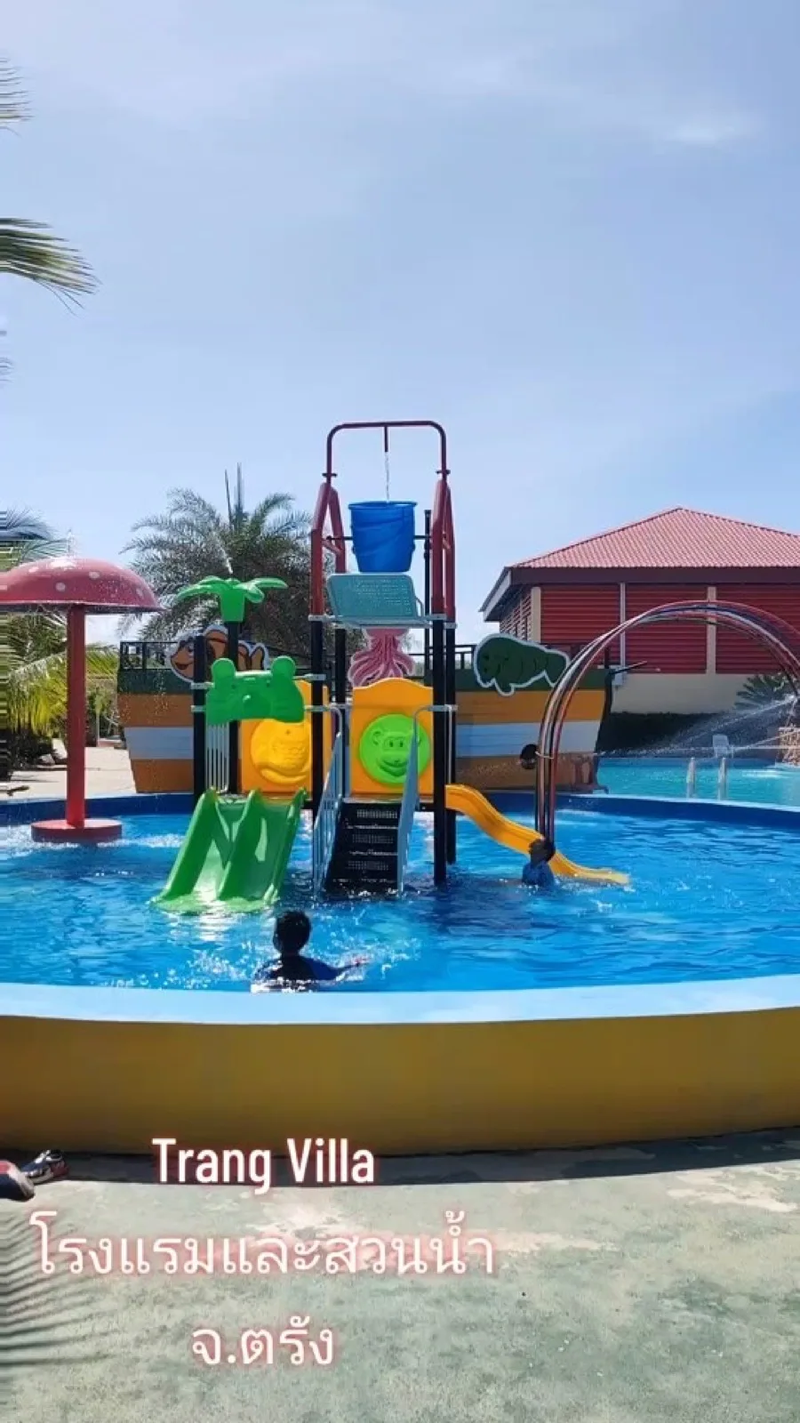 Children's splash pool with a colourful play structure at TrangVilla water park