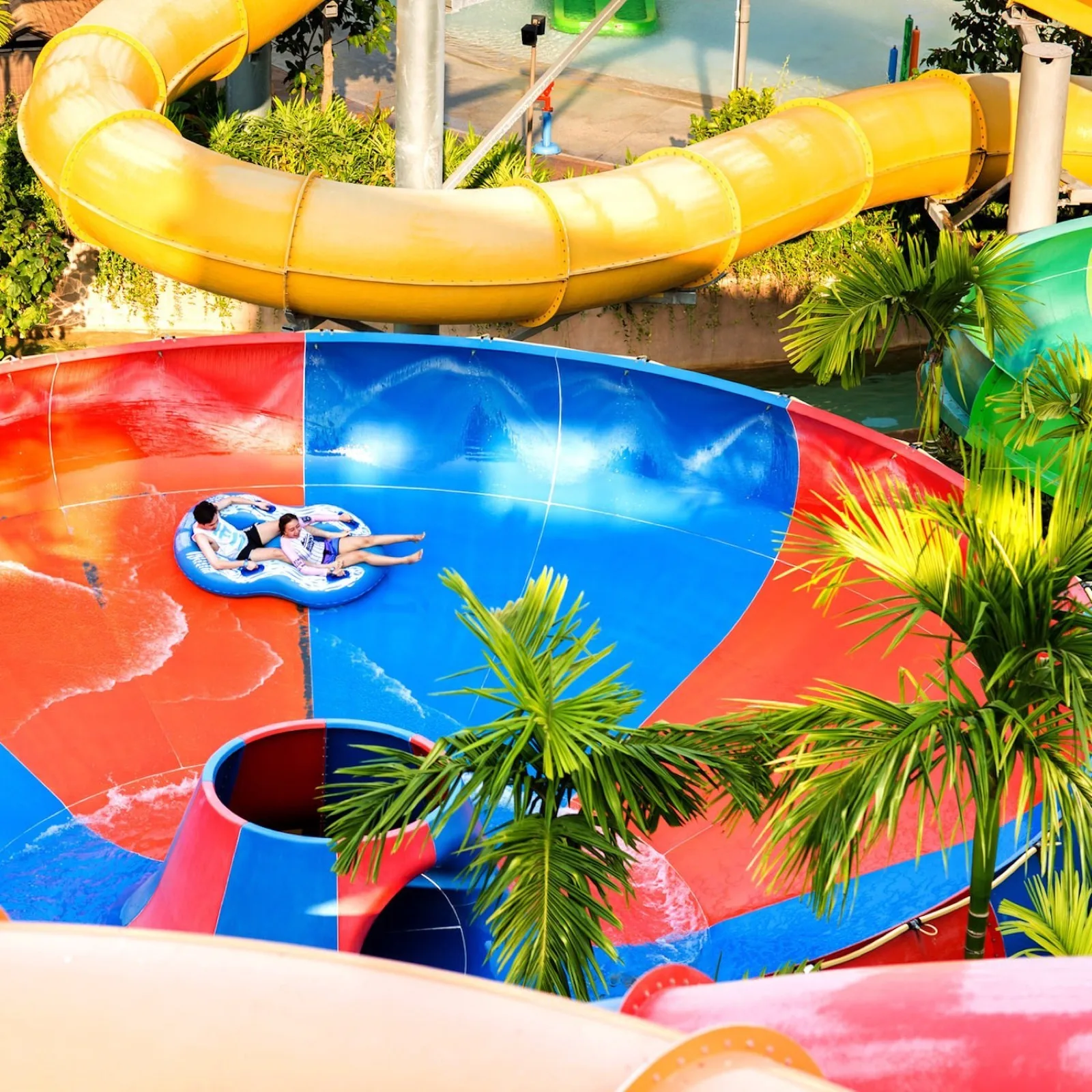 Riders spinning in the bowl slide at Vana Nava Water Jungle Hua Hin