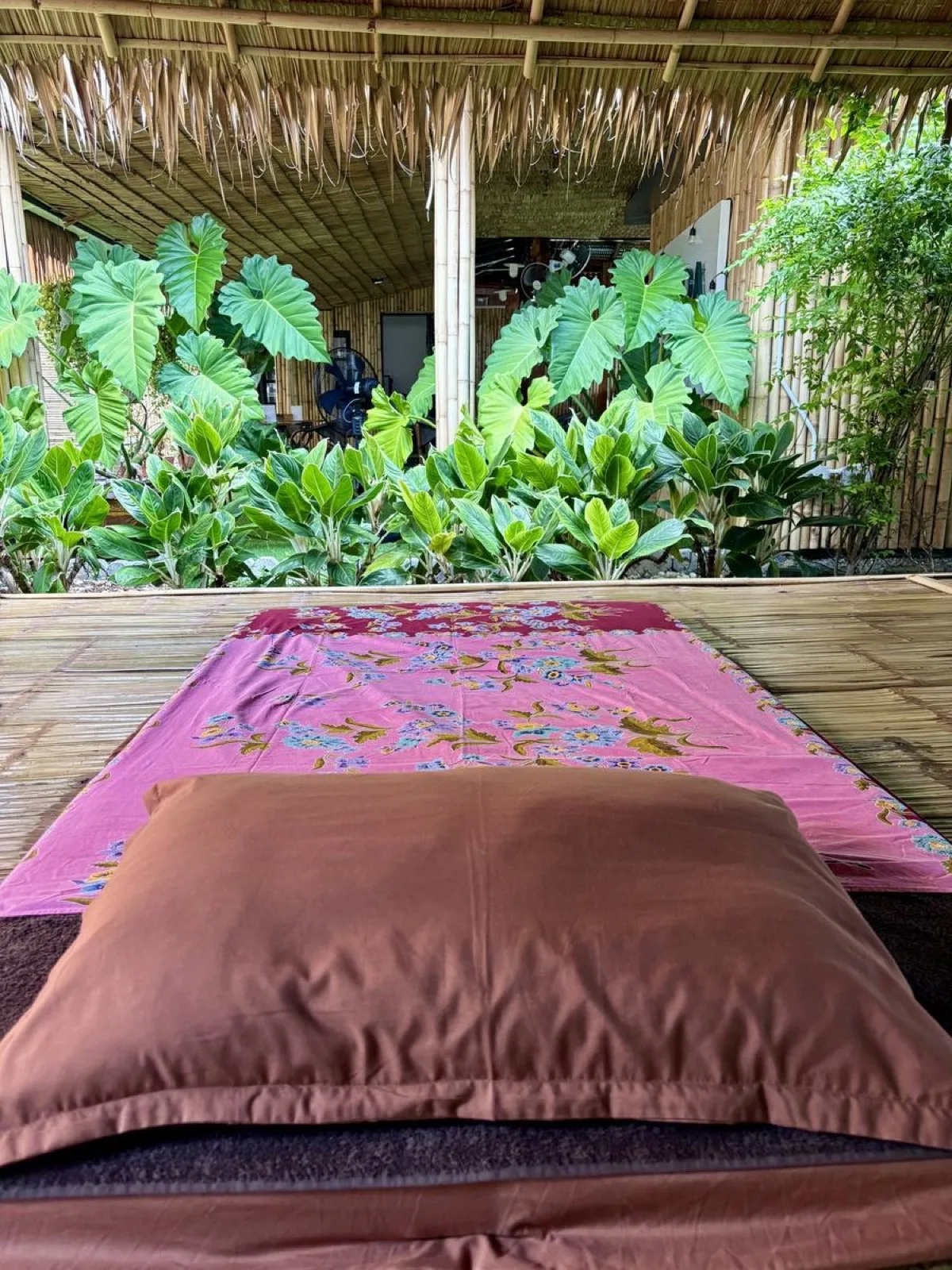 Open-air massage sala with mats and cushions at Vihara Sanctuary