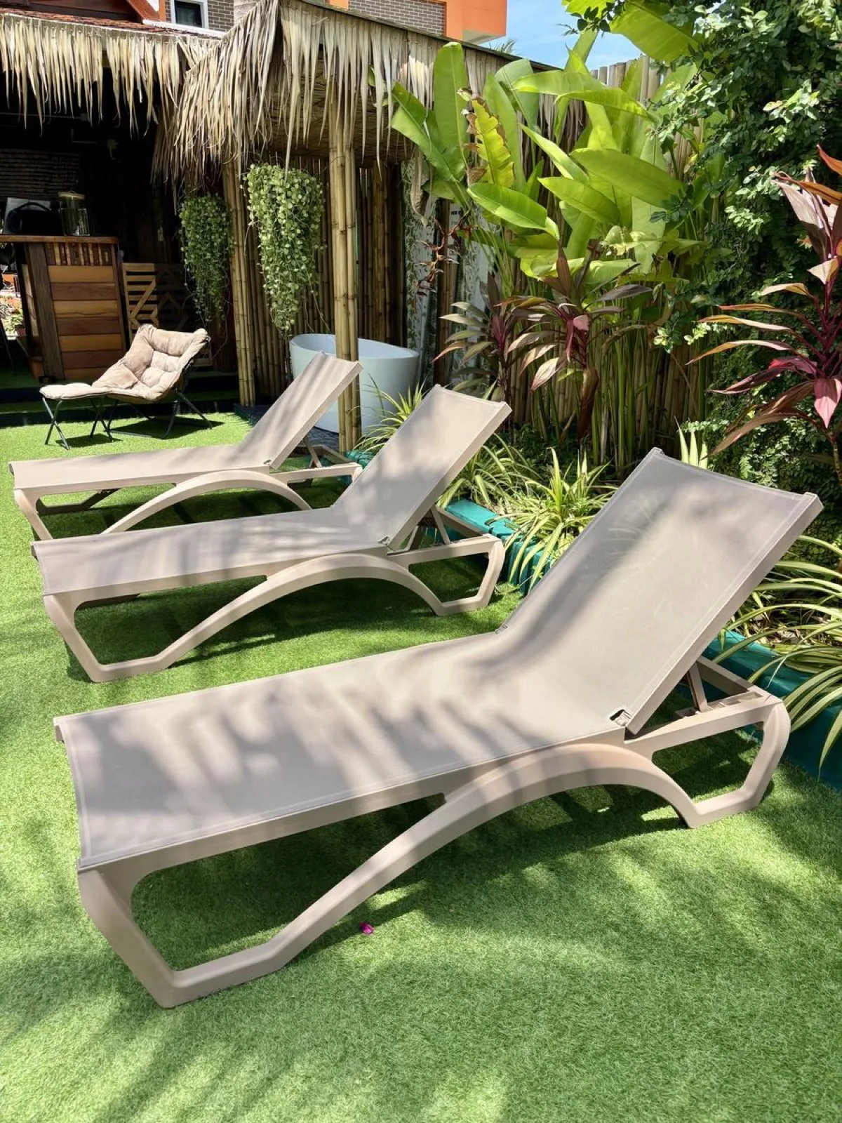 Loungers on the lawn for resting between sauna rounds at Vihara Sanctuary Lamai