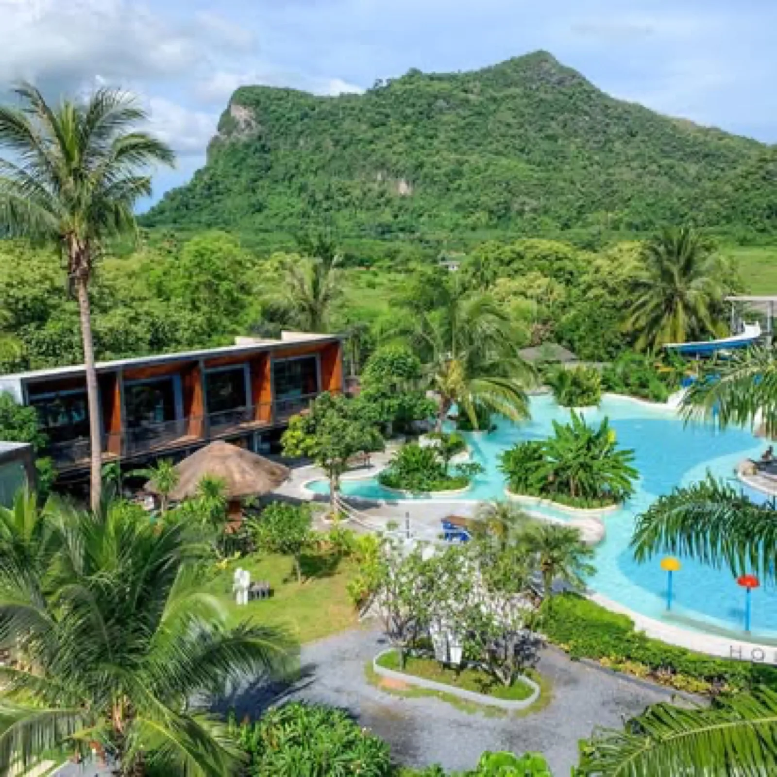 Lagoon pool, rooms and limestone hill at Warehouse18 Pool Cafe Resort, Surat Thani