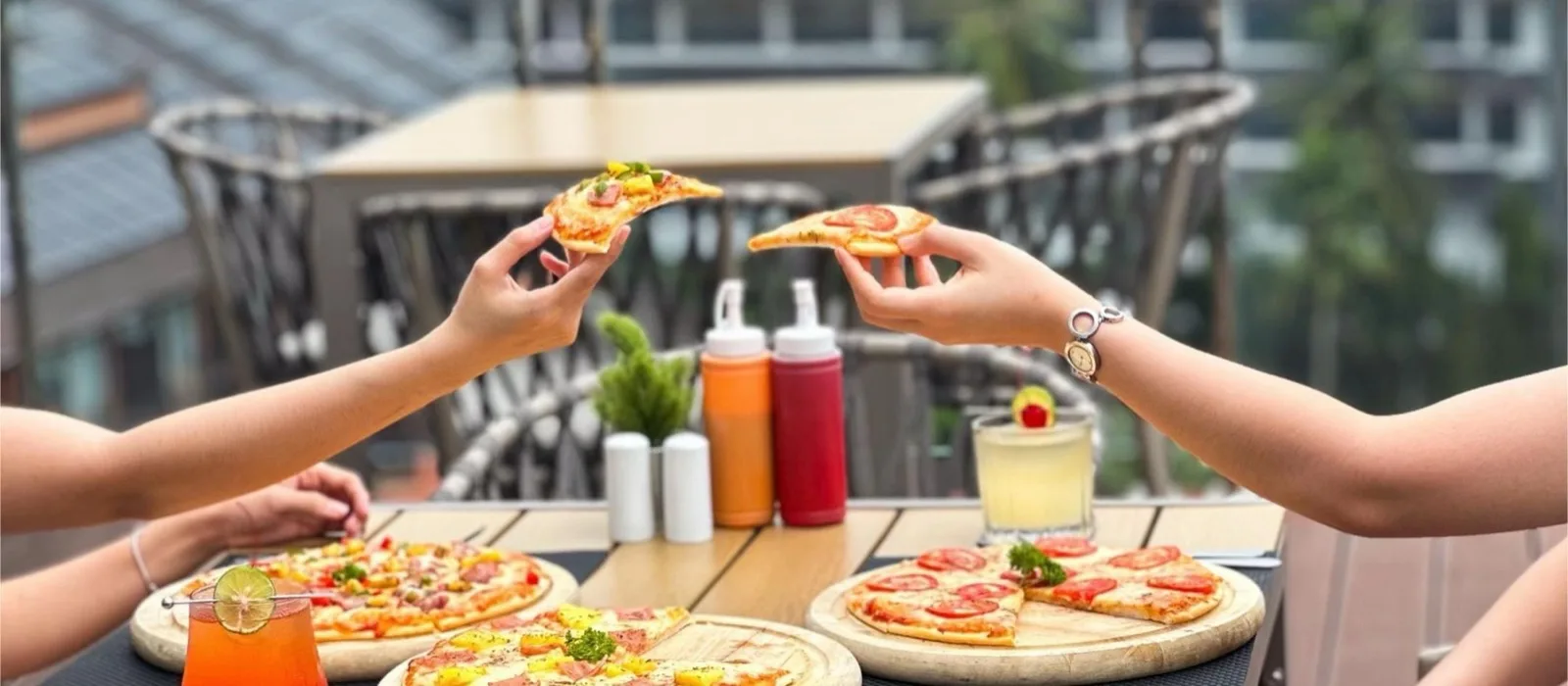 Pizza and drinks at the YouDee Hotel Patong rooftop pool bar